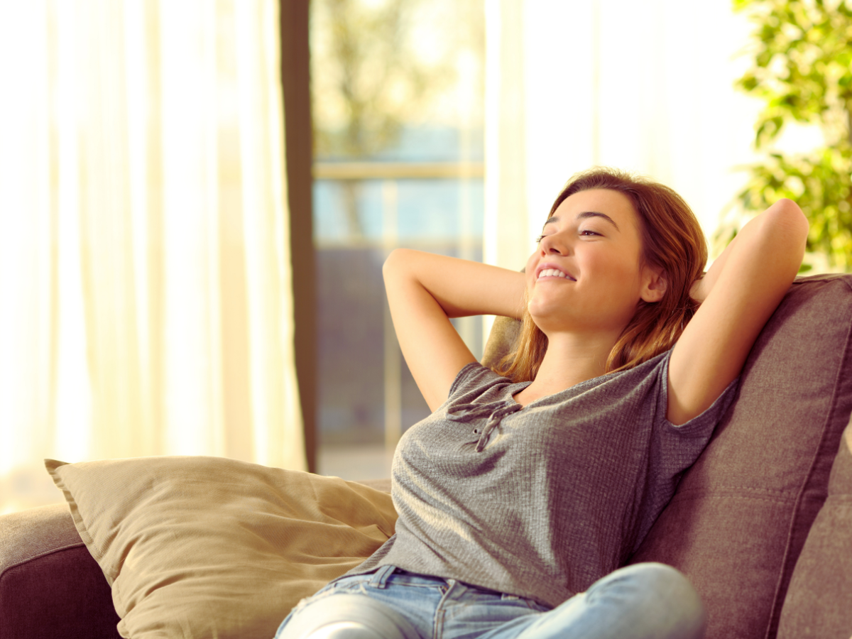 Woman enjoying benefits of whole-home dehumidifier 