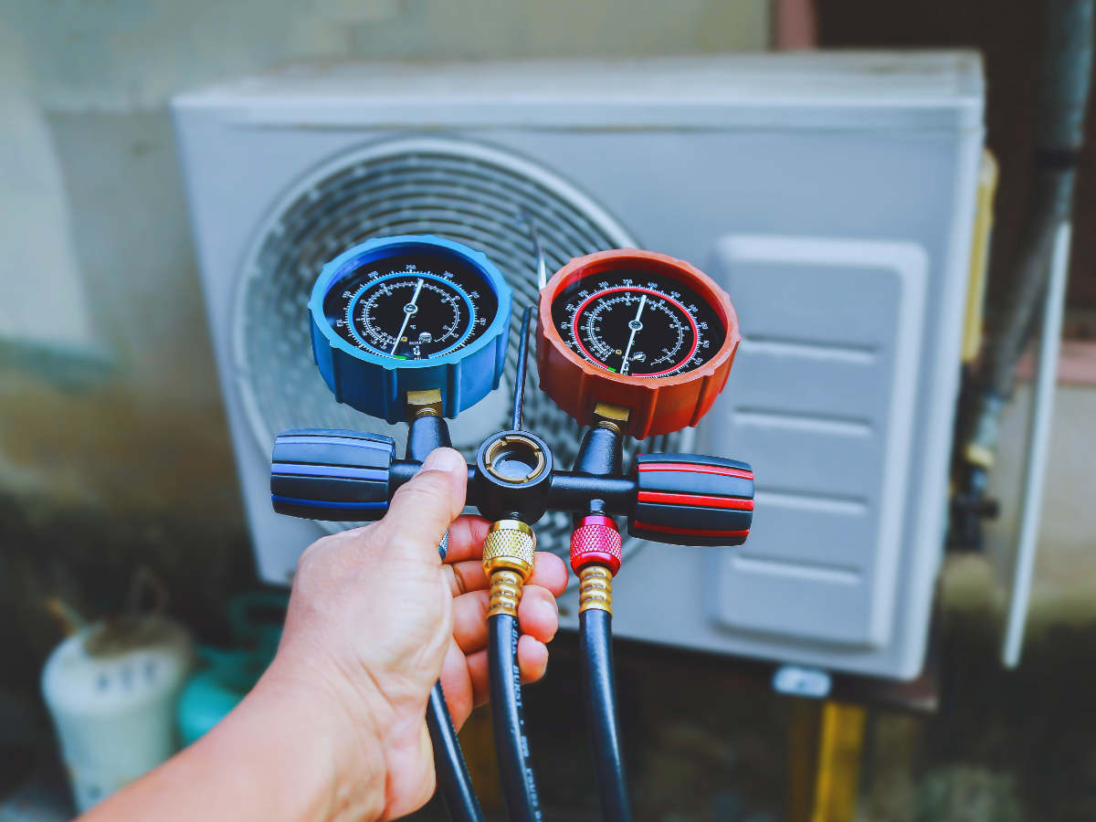 HVAC tech testing refrigerant levels
